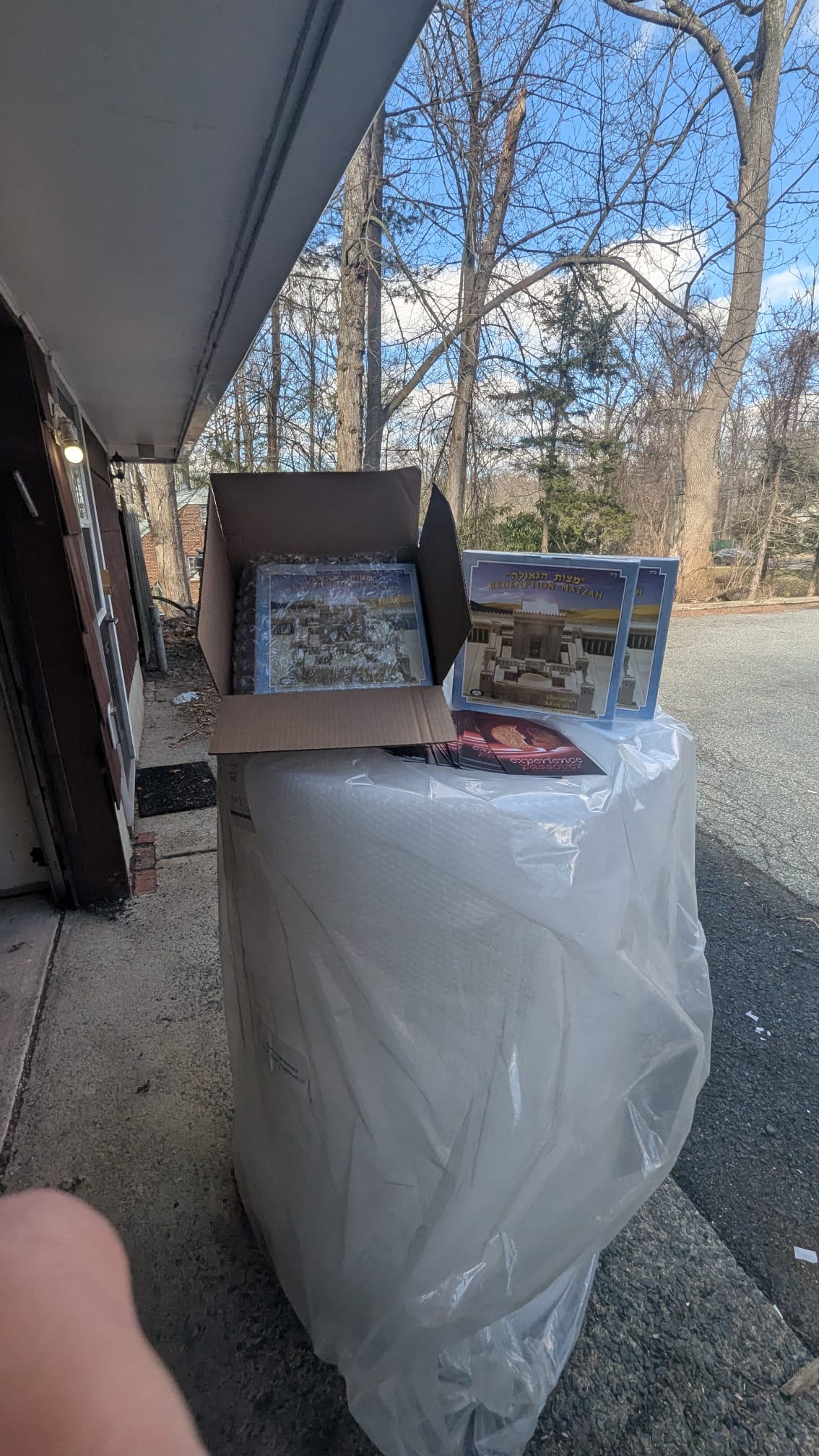 Matzah packages being prepared outdoors for delivery